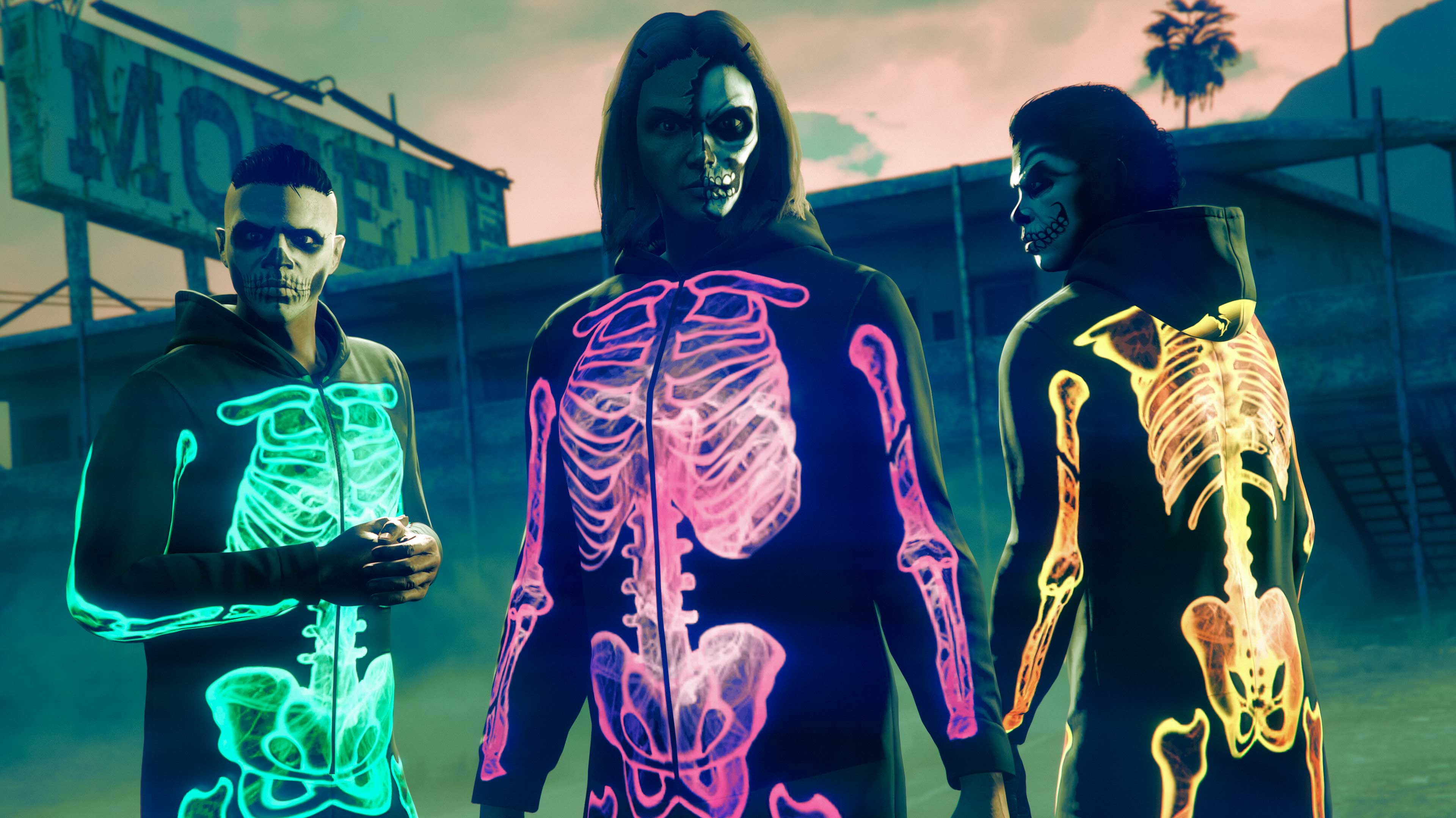 Screenshot of three GTA Online characters wearing Purple, Green and Yellow Glow Skeleton Onesies.